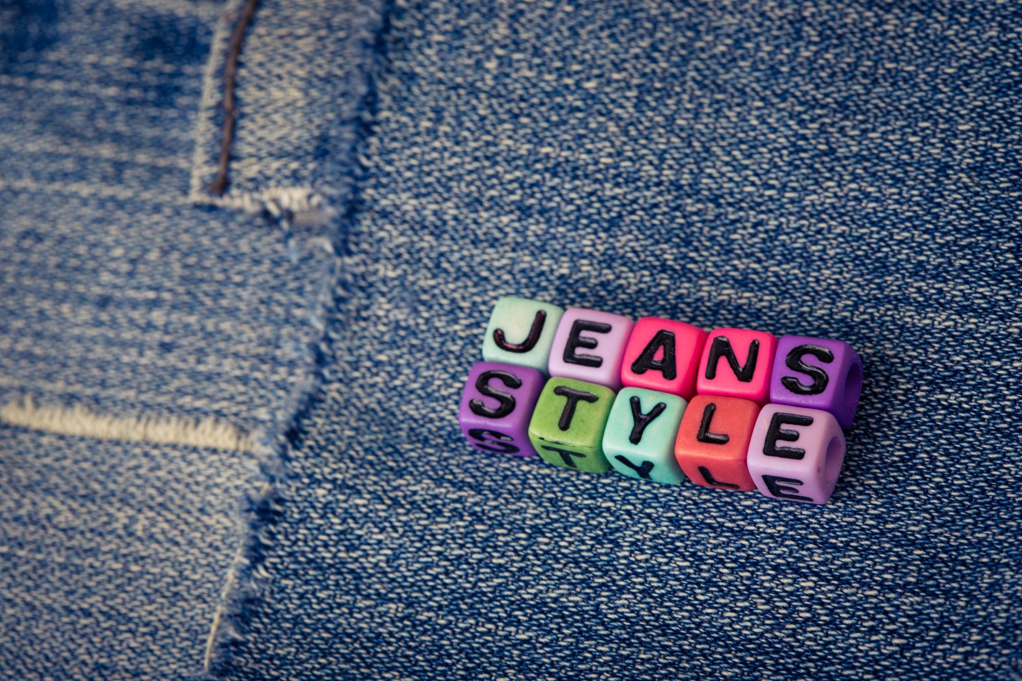 Custom embroidered brand badges on denim